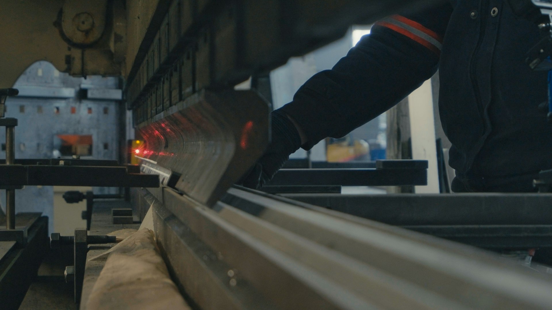A man working on a machine in a factory